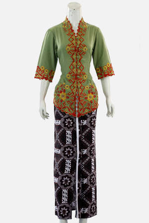 Women's classic kebaya with a long batik-patterned skirt can show authentic beauty in Indonesian women.の写真素材