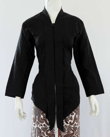 Women's black kebaya with plain patterns gives a graceful impression with a traditional taste but still fashionable.の写真素材