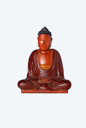 Buddha statue, made of wood with a meditation sitting position. A figure known to be sacred among Buddhists.の写真素材