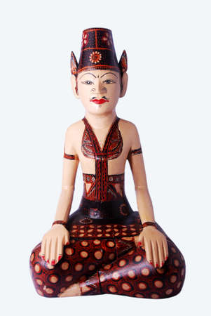 The figure of the statue of the groom wearing traditional Javanese clothes, isolated on white.の写真素材