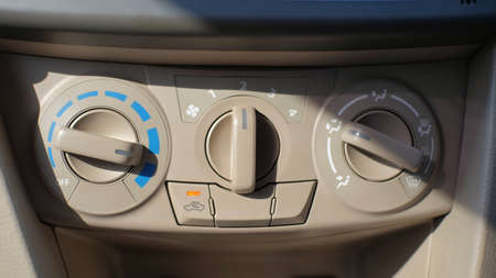 Control the temperature and speed of the car Air Conditioning fan which is located on the dashboard to make it easier for drivers to reach itの写真素材