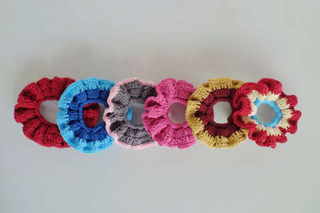 Vintage design hair tie made of yarn, knitted in beautiful color variantsの写真素材