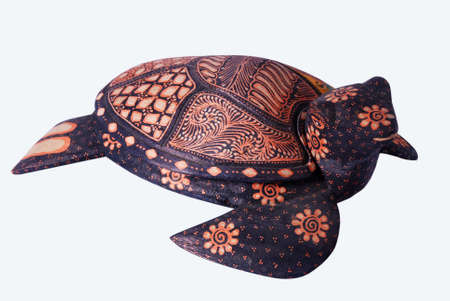 The application of batik on wood resembles a turtle as an interior decorationの写真素材