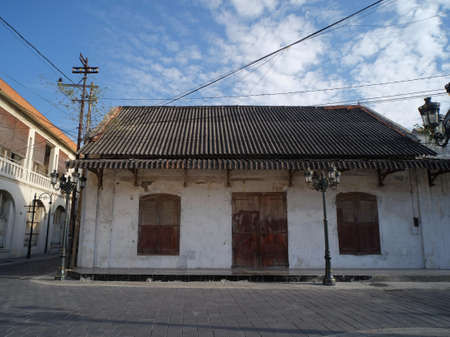 Semarang, Indonesia, 19/09/2020: An old building with large windows and doors that still stands firmly in the Kota Lama area. In the past it seemed to function as a warehouse.のeditorial素材