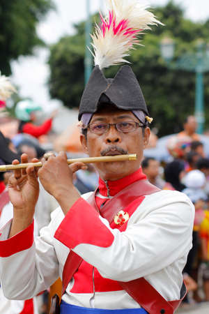 Yogyakarta, Indonesia, Oct 5, 2014. Portrait of the Yogyakarta Palace soldiers who were in charge of accompanying troops with flute music during a parade of cultural eventsのeditorial素材