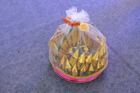 Yogyakarta, Indonesia, 25 Aug 2019. Seserahan in the form of golden bananas brought by the groom's entourage to be handed over to the bride in the Javanese wedding tradition.のeditorial素材