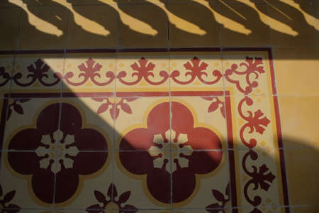 Top view of flower motif tile floor exposed to the sun the atmosphere feels warmer and classic.の写真素材