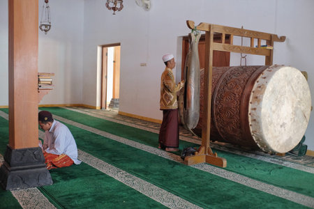 Yogyakarta, Indonesia, Aug 7, 2019. Large drum in a historic mosque. The musical instrument made from wood and cow leather will be sounded as a sign of a call to worship together.のeditorial素材