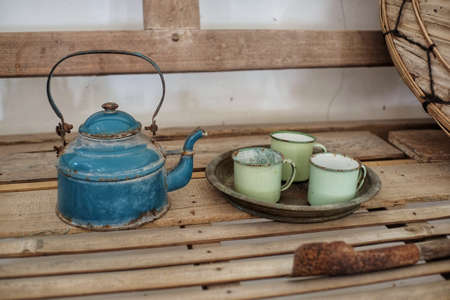 Chinese antique teapot and cups on bamboo table.の写真素材