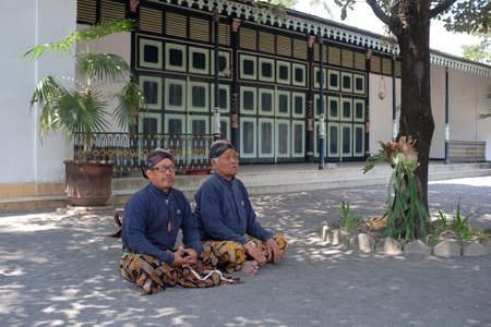 Yogyakarta, Indonesia, July 28, 2019: Abdi dalem or palace maid staff sat cross-legged guarding at the Yogyakarta Palace Complex.のeditorial素材