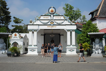 Yogyakarta, Indonesia, July 28, 2019: A guide tells information to foreign tourists at the Yogyakarta Palace Complex.のeditorial素材