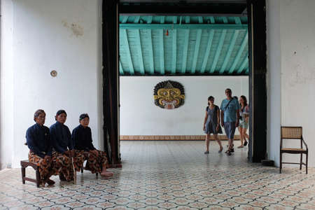 Yogyakarta, Indonesia, July 28, 2019: Abdi dalem or palace maid staff are on guard to guard the gate which is the tourist traffic lane in the Yogyakarta Palace Complex.のeditorial素材