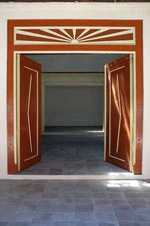 The old wooden door on the limasan house is typical of a Javanese house. Generally made of classy teak wood.の写真素材