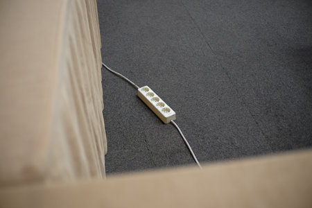 Plug terminals for power supply on carpet in a room.の写真素材