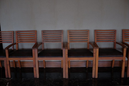 Rows of chairs with a classic brown minimalist design.の写真素材