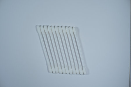 Cotton buds, a cleaning device for removing wax in the ear cavity isolated on a white background.の写真素材