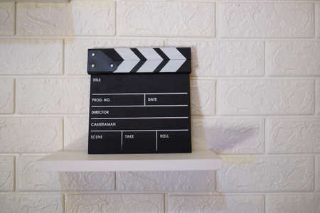 A clapperboard, device used in filmmaking and video production to assist in synchronizing of picture and sound.の写真素材