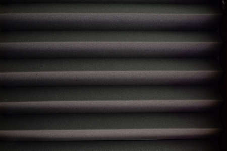 The background is dark gray with a horizon line pattern to support various basic needs for visual design art.の写真素材