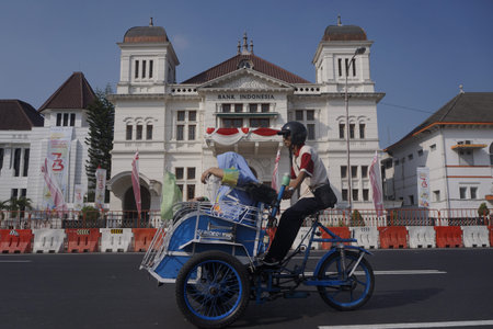 Yogyakarta, Indonesia, Aug 12, 2108. Motorized tricycles pass in front of historic buildings of bank Indonesia in the center of Yogyakarta is one of the cities that developed Javanese culture.のeditorial素材