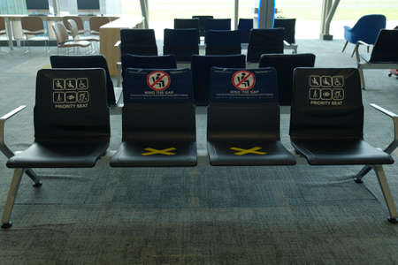 Priority seats in an airport waiting room are reserved for disabled passengers.の写真素材