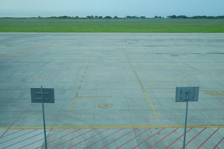Empty aircraft parking area around the runway complex.の写真素材