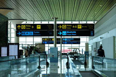 Kulonprogo, Indonesia, Dec 19, 2021. Information for aircraft boarding door instructions in Indonesian, English, Mandarin, Arabic at Yogyakarta International Airport.のeditorial素材