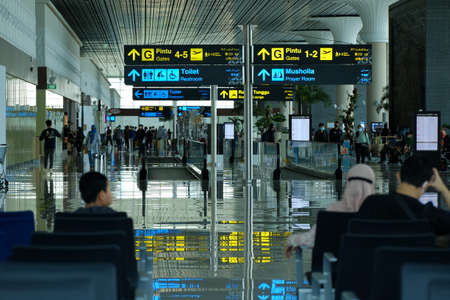 Kulonprogo, Indonesia, Dec 19, 2021. Information for aircraft boarding door instructions in Indonesian, English, Mandarin, Arabic at Yogyakarta International Airport.のeditorial素材