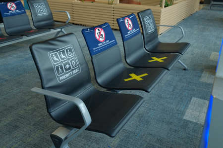Priority seats in an airport waiting room are reserved for disabled passengers.の写真素材