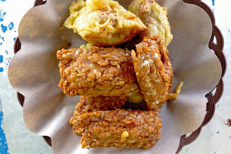 Dry fried tempeh is served on the table. Usually consumed as a snack or side dish when eating.の写真素材