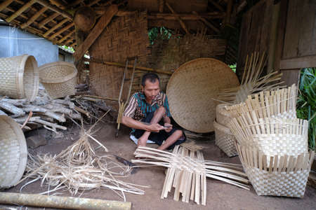 Yogyakarta, Indonesia, March 4, 2022. Bamboo craftsmen with disabilities who strive to be independent by working to make handicraft products.のeditorial素材