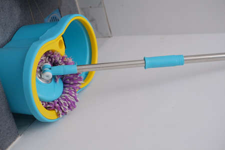 A floor mopping tool that is placed in one corner of the house.の写真素材