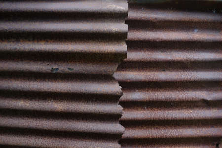 Thin steel plate whose surface rusts with age and weather. Artistic abstract background for unique visual communication design purposes.の写真素材