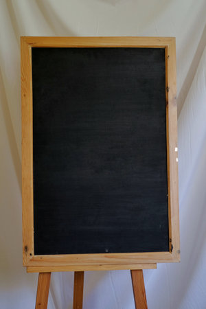 Vertical blackboard, empty space for writing and drawing information.の写真素材