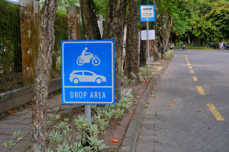 Signs as temporary stop signs for pick-up or drop-off points for motorized vehicle passengers.の写真素材