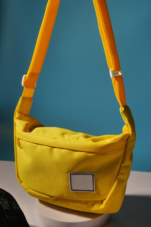 A casual yellow sling bag that is simple but fashionableの写真素材