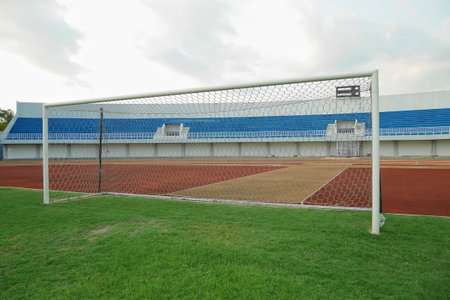 Football goal with stands in the background open to spectatorsの写真素材