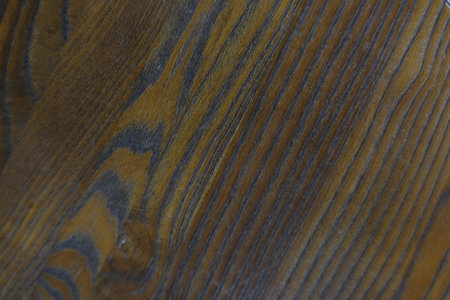 Natural background on polished wooden surface with artistic wood grain patterns.の写真素材