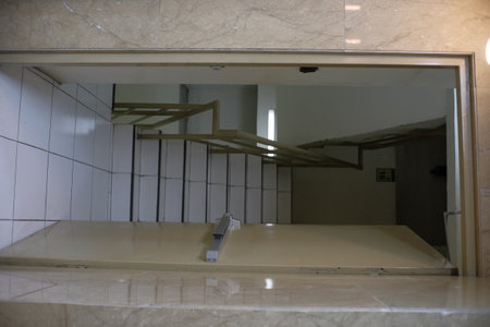 Emergency door access in a multi-storey building, each floor is connected by a manual staircase.の写真素材