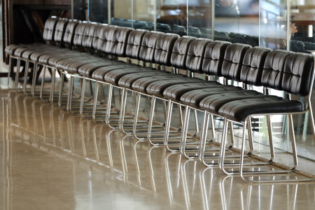 Rows of chairs in a buildingの写真素材