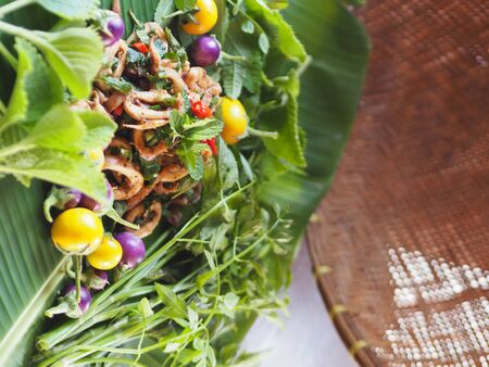 Thai salad - Squid spicy salad on basketry backgoundの写真素材