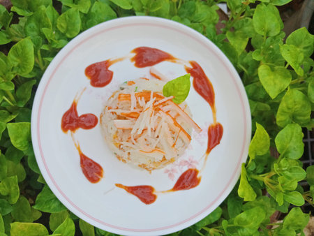 Thai food street - fried rice with crab sticks in white plate on watercress leafの写真素材