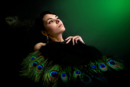 sexy girl in a dress with peacock feathers