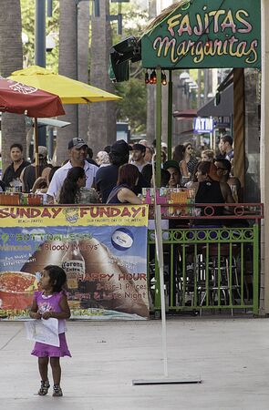 young girl in front of Mexican restaurantのeditorial素材