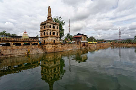 Haridra Tirtha(Water tank) and Lamp tower located at Cholachagudd near Badami District Bagalkot State Karnataka India November 16 2009のeditorial素材