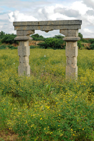 Ruins of a temple gate in a field at Koppal State Karnataka India November 2009のeditorial素材