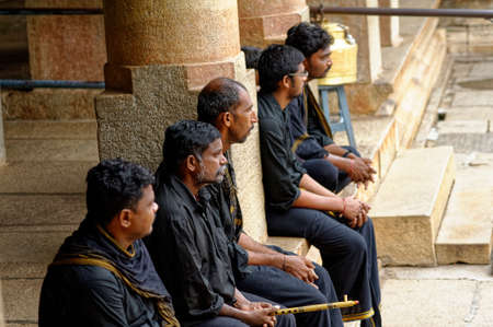 South Indian people visiting The Gommateshwara statue located on Vindyagiri at Shravanbelagola in the Indian state of Karnataka November 2009のeditorial素材