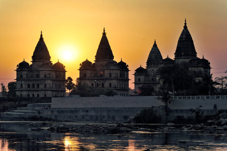Sunset behind Chhatris on the bank of the Betwa River at Orchha district Niwari state Madhya Pradesh India 03 13 2010のeditorial素材
