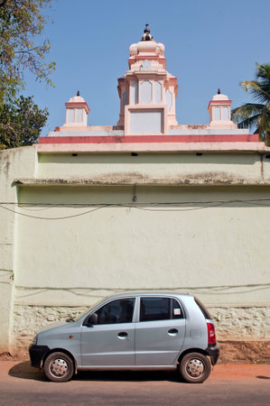 Car parked in front of Hindu Temple at city Thiruvananthapuram state Kerala India 01 25 2010のeditorial素材