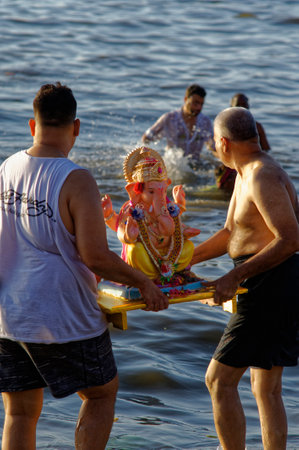 Immersion of elephant headed God Ganpati (Ganesha) in Arabian Sea at Mumbai state Maharashtra India 09 17 2018のeditorial素材