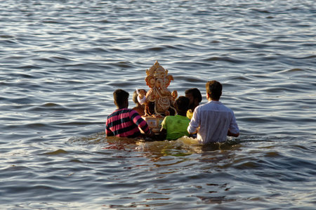 Immersion of elephant headed God Ganpati (Ganesha) in Arabian Sea at Mumbai state Maharashtra India 09 17 2018のeditorial素材